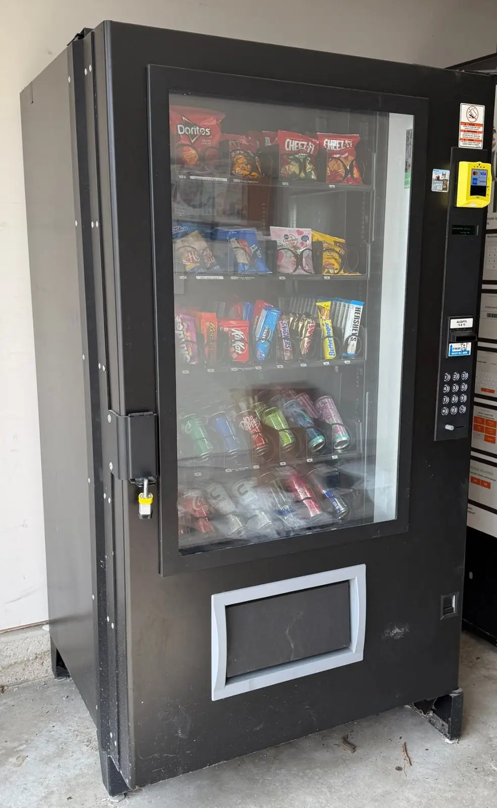 WhyCuz vending machine at a covered outdoor location