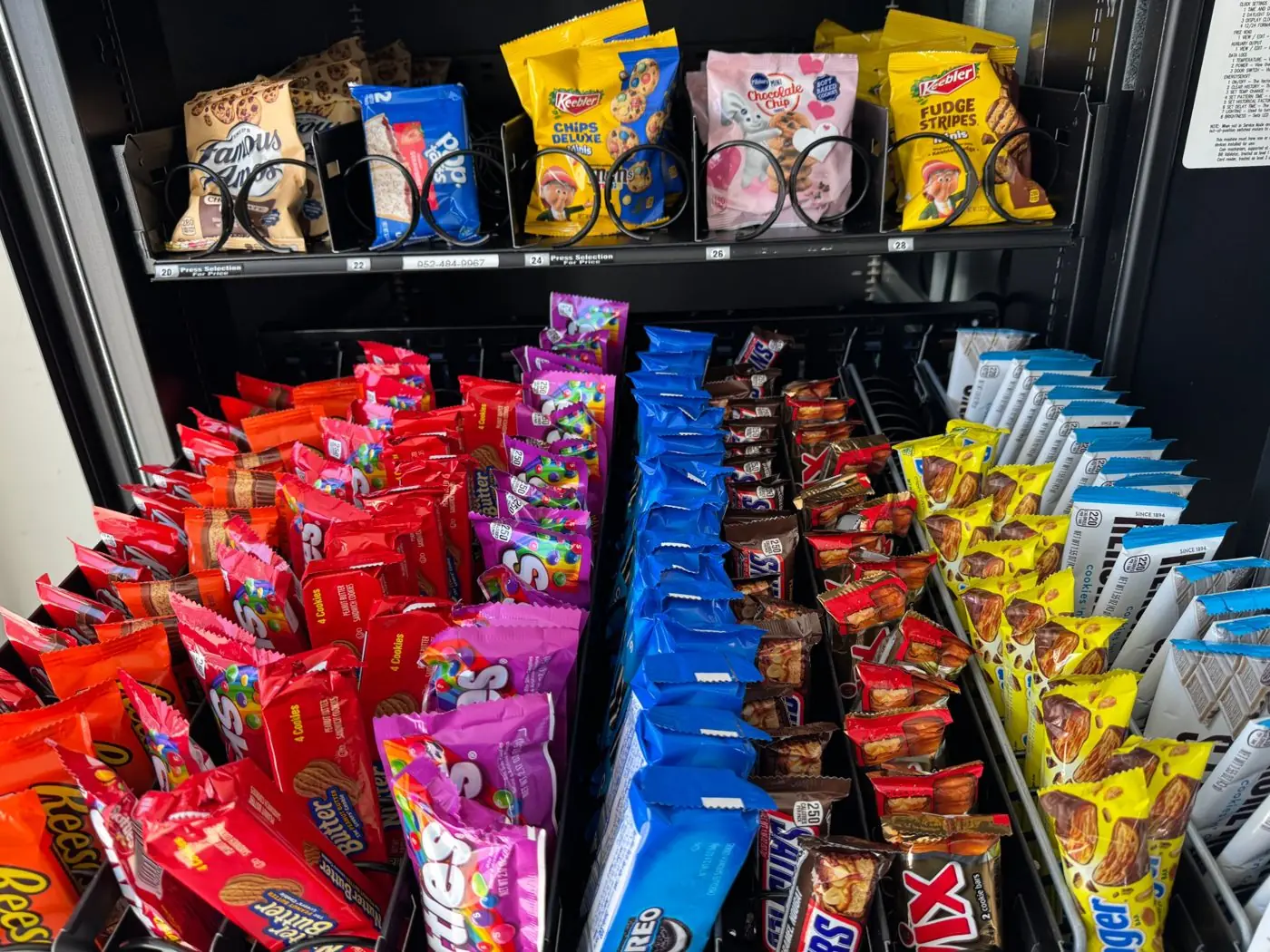 Fully stocked snack rows in a WhyCuz vending machine